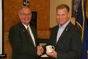 Mark Witzel (r), chapter president, thanks Steve Sampson, vice president, advanced programs, Cubic Defense Applications Incorporated, for his presentation during the July luncheon.